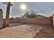 A desert landscaped backyard featuring a brick paved area and block wall at 10353 W Atlantis Way, Tolleson, AZ 85353