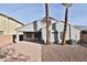 Back of the house featuring a desert landscape with a brick paved area at 10353 W Atlantis Way, Tolleson, AZ 85353