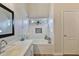 Bright bathroom features a soaking tub, tiled shower, and updated vanity at 10353 W Atlantis Way, Tolleson, AZ 85353