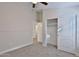 A bedroom featuring neutral walls, carpet flooring, closet, and an open doorway at 10353 W Atlantis Way, Tolleson, AZ 85353