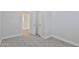 A bedroom featuring neutral walls, carpet flooring, closet, and an open doorway at 10353 W Atlantis Way, Tolleson, AZ 85353