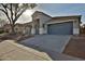 Stylish single-story home with a two-car garage and well-maintained landscaping at 10353 W Atlantis Way, Tolleson, AZ 85353