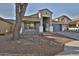 Charming single-story home featuring a desert-landscaped front yard and a two-car garage at 10353 W Atlantis Way, Tolleson, AZ 85353