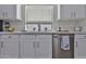 Close up on the kitchen with stainless steel appliances and white cabinets at 10353 W Atlantis Way, Tolleson, AZ 85353