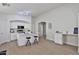 Modern kitchen featuring white cabinetry, a functional island, and stainless steel microwave at 10353 W Atlantis Way, Tolleson, AZ 85353
