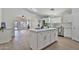 Bright kitchen with a large island, stainless steel appliances, and ample cabinet space at 10353 W Atlantis Way, Tolleson, AZ 85353