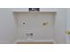 Clean laundry room with white walls, a shelf, and hookups ready for appliances at 10353 W Atlantis Way, Tolleson, AZ 85353