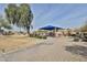 Community playground featuring slides, a covered play area, and surrounding landscaping at 10353 W Atlantis Way, Tolleson, AZ 85353