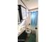 Bathroom featuring a shower/tub combination and blue striped shower curtain at 111 S Greenfield Rd # 426, Mesa, AZ 85206