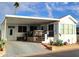 Charming home featuring an inviting covered front porch and landscaped front yard at 111 S Greenfield Rd # 426, Mesa, AZ 85206