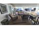 Screened in porch features cozy seating, offering a relaxing and private outdoor space at 111 S Greenfield Rd # 426, Mesa, AZ 85206