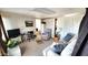 Living room with a recliner, sofa, television, and view of the bathroom at 111 S Greenfield Rd # 426, Mesa, AZ 85206