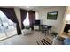 Comfortable living room with TV, curtains, and view of the deck at 111 S Greenfield Rd # 426, Mesa, AZ 85206