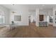 Well-lit dining area with hardwood floors, stylish light fixtures, and direct views into the living room at 11232 E Palomino Rd, Scottsdale, AZ 85259