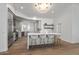 Open concept kitchen with a marble island, seating, and sleek gray cabinets at 11232 E Palomino Rd, Scottsdale, AZ 85259
