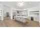 Spacious kitchen featuring an island with seating, stainless steel appliances, and modern countertops at 11232 E Palomino Rd, Scottsdale, AZ 85259