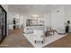 Inviting open living space featuring modern furniture and a glimpse into the stylish kitchen at 11232 E Palomino Rd, Scottsdale, AZ 85259