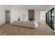 Spacious living room featuring hardwood floors, modern decor, a fireplace, and natural light at 11232 E Palomino Rd, Scottsdale, AZ 85259