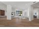 Bright and spacious living room with wood floors, modern furniture, and an abundance of natural light at 11232 E Palomino Rd, Scottsdale, AZ 85259