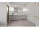 Bright bathroom boasts a walk-in shower, sleek vanity, contemporary fixtures, and modern lighting at 11232 E Palomino Rd, Scottsdale, AZ 85259