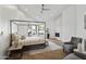 Bright main bedroom boasts a fireplace, vaulted ceilings, modern ceiling fan, and a canopy bed at 11232 E Palomino Rd, Scottsdale, AZ 85259