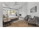 Serene main bedroom with a fireplace, light-filled windows, and seating area at 11232 E Palomino Rd, Scottsdale, AZ 85259