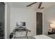 Bedroom featuring a modern ceiling fan and a gaming desk at 11357 E Unger Ave, Mesa, AZ 85212