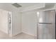 View of stainless steel refrigerator in bright, minimalist kitchen area at 1149 E 5Th St, Casa Grande, AZ 85122