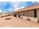 Exterior featuring an expansive brick patio and a well-maintained backyard and exterior of the house at 13602 W Ballad Dr, Sun City West, AZ 85375