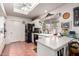 Well-lit kitchen with ample counter space, white cabinetry, and black appliances at 13602 W Ballad Dr, Sun City West, AZ 85375