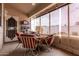 Charming screened patio with dining table, seating, and views of the outdoor area at 13602 W Ballad Dr, Sun City West, AZ 85375