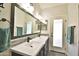 Bathroom featuring a double sink vanity and modern fixtures at 15764 W Shiloh Ave, Goodyear, AZ 85338