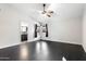 This bedroom offers hardwood floors, bright natural light, and direct access to an en-suite bathroom at 15764 W Shiloh Ave, Goodyear, AZ 85338