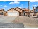 Charming single-story home featuring a two-car garage and low maintenance desert landscaping at 15764 W Shiloh Ave, Goodyear, AZ 85338