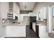 Bright kitchen with stylish countertops, white cabinetry, and stainless steel appliances at 15764 W Shiloh Ave, Goodyear, AZ 85338