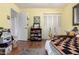 Bedroom featuring hardwood-style flooring and access to a closet and bathroom at 16631 N 36Th Ave, Phoenix, AZ 85053