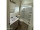 Clean bathroom with a stand up shower, modern vanity, and neutral tones at 1853 W Burgess Ln, Phoenix, AZ 85041