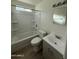 Bright bathroom with a shower-tub combo, modern vanity, and updated fixtures at 1853 W Burgess Ln, Phoenix, AZ 85041