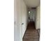 Hallway featuring wood floors leads to other rooms in the house at 1853 W Burgess Ln, Phoenix, AZ 85041