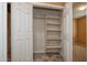 Spacious closet with built-in shelving, offering ample storage and organization at 20156 N 269Th Ln, Buckeye, AZ 85396