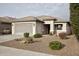 Charming single-story home with a well-maintained desert-style front yard and two car garage at 20156 N 269Th Ln, Buckeye, AZ 85396