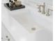 Modern bathroom sink featuring a stylish faucet and quartz countertop, plus elegant toiletries at 20334 W Roma Ave, Buckeye, AZ 85396