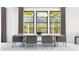 Elegant dining room with modern table, comfortable chairs, and ample natural light at 20334 W Roma Ave, Buckeye, AZ 85396