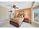 Bedroom with en suite bathroom featuring natural light and spacious layout at 20462 N Ridgewood Ln, Surprise, AZ 85374