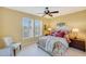 Bedroom with natural light from plantation shutters and ceiling fan at 20462 N Ridgewood Ln, Surprise, AZ 85374