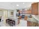 Bright kitchen features granite counters, center island with seating, and stainless appliances at 20462 N Ridgewood Ln, Surprise, AZ 85374