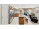 Modern kitchen featuring stainless steel appliances, a kitchen island, and an adjacent breakfast nook at 20462 N Ridgewood Ln, Surprise, AZ 85374