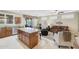 Open concept with a kitchen island leading into a cozy living area featuring comfortable seating at 20462 N Ridgewood Ln, Surprise, AZ 85374