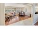 Spacious open concept with hardwood flooring, a dining table, and abundant natural light at 20462 N Ridgewood Ln, Surprise, AZ 85374