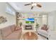 Comfortable living room with a modern fireplace, built in shelving, and stylish decor at 20462 N Ridgewood Ln, Surprise, AZ 85374